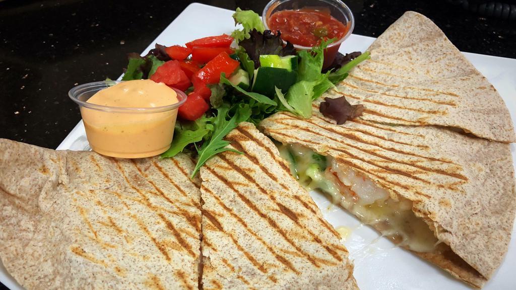 Spicy Shrimp Quesadilla · Shrimps, Monterey Jack Cheese, Jalapeno peppers.
Side of garnish salad, spicy chipotle sauce and mild Salsa.