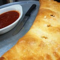 Spinach Stromboli (Large) · Spinach, tomatoes, fresh mozzarella and pesto.