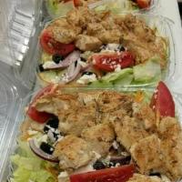 Chicken Kabob Salad · House marinated and grilled chicken on top a greek salad. Comes with pita bread.