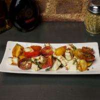 Gf Caprese Salad · heirloom tomato , mozzarella campana , basil , age balsamic