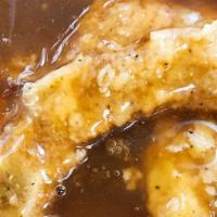 2 Smothered Pork Chops With 2 Sides · Two pieces. Tender and juicy fried pork chops and then smothered in gravy, served with two s...