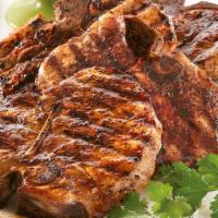 2 Cajun Grilled Pork Chops With 2 Sides · Two pieces. Tender and juicy grilled pork chops, served with two side dishes and choice of b...