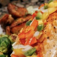 Crabmeat Stuffed Salmon · Stuffed with real jumbo lump crabmeat and baked to perfection, served with two side dishes a...