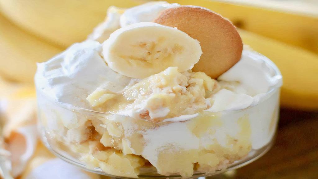 Banana Pudding · Creamy banana pudding with sliced bananas topped with vanilla wafers.