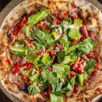 Italian Grinder · Ham, salami, Mozzarella, lettuce, tomato, onions, roasted red peppers, Italian dressing.