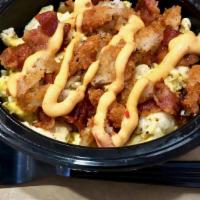 M&P Bowl · 3 Scrambled eggs, potato pancakes with bacon or turkey sausage & house spread on top.