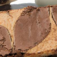 Cheesecake Brownie · A classic dark chocolate brownie batter with a cheesecake swirl on top!