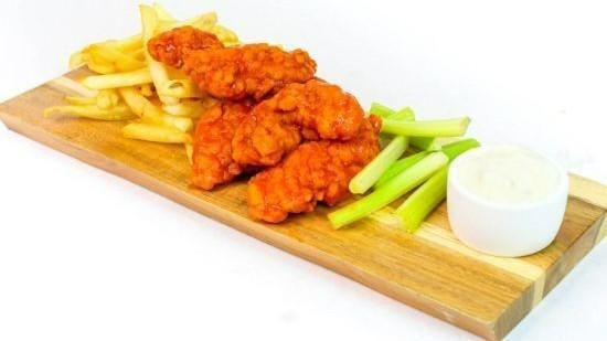 Buffalo Chicken Tenders · Chicken tenders cooked golden-brown and crispy, tossed in a buffalo sauce, and served with fries and your choice of dipping sauce.