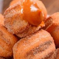 Mini Churros Box 50 · Fried Sweet Dough filled with Dulce de Leche and Dusted with Cinnamon and Sugar.