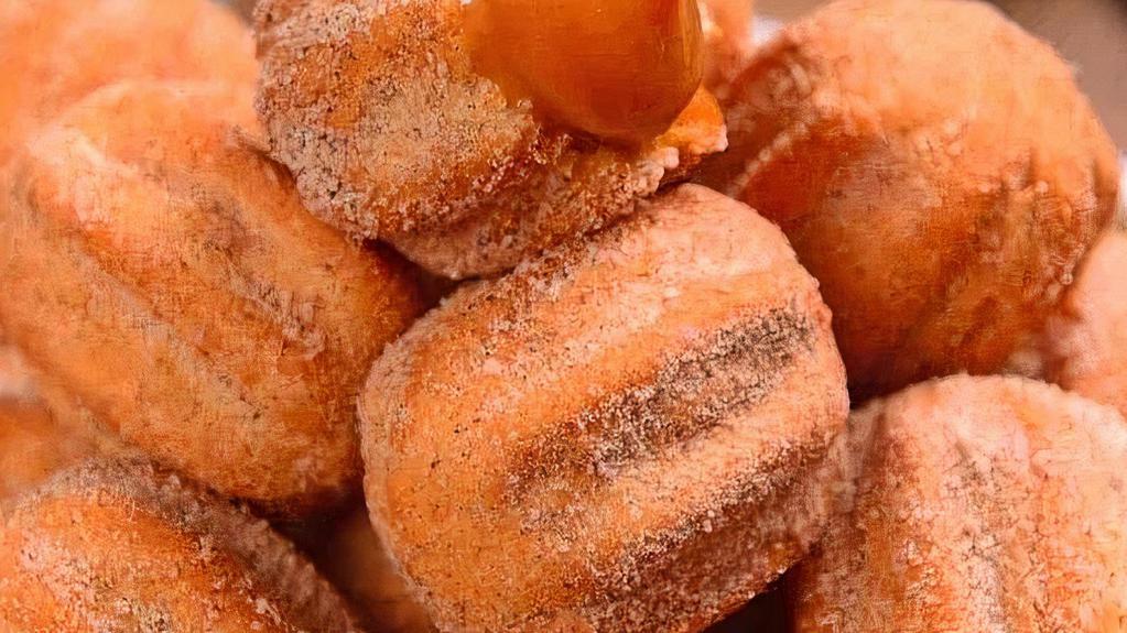 Mini Churros Cup 25 · Fried Sweet Dough filled with Dulce de Leche and Dusted with Cinnamon and Sugar.