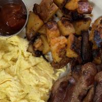 Egg-Ceptional Breakfast · Three farm fresh eggs, choice of protein, home fries, side of toast.