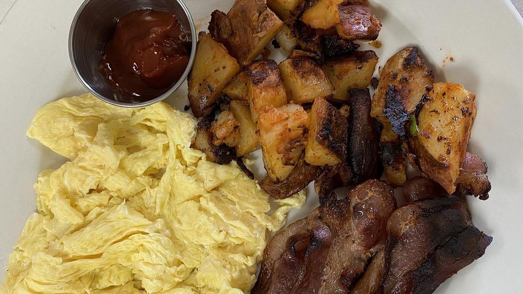 Egg-Ceptional Breakfast · Three farm fresh eggs, choice of protein, home fries, side of toast.