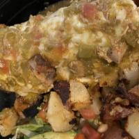 Colorado Breakfast Burrito · Scrambled eggs, potatoes, refried beans, melted Oaxaca cheese, smothered with house made gre...