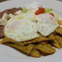 Chilaquiles · Gluten free. Tortilla chips topped with our house-made red and green salsas, two eggs your w...