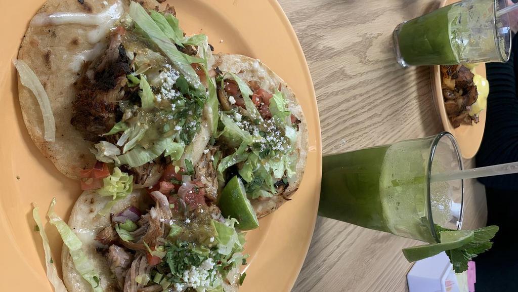 Carnitas Tacos · Gluten free. 3 corn tortillas topped with fried carnitas, cilantro, pico de gallo, salsa verde. Served with beans and shredded lettuce