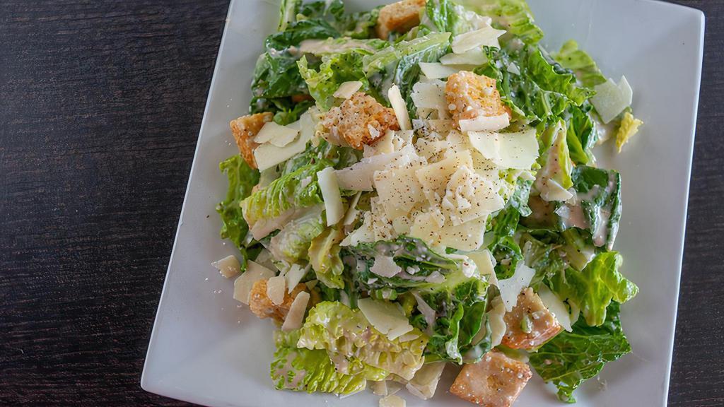 Classic Caesar · Crisp romaine lettuce with croutons, parmesan cheese and caesar dressing.