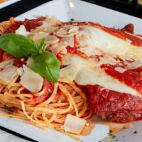 Chicken Parmigiana · Served over angel hair spaghetti with marinara sauce and mozzarella cheese.