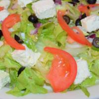 Greek Salad · Lettuce, Roma tomatoes, green peppers, onions, black olives, feta cheese.