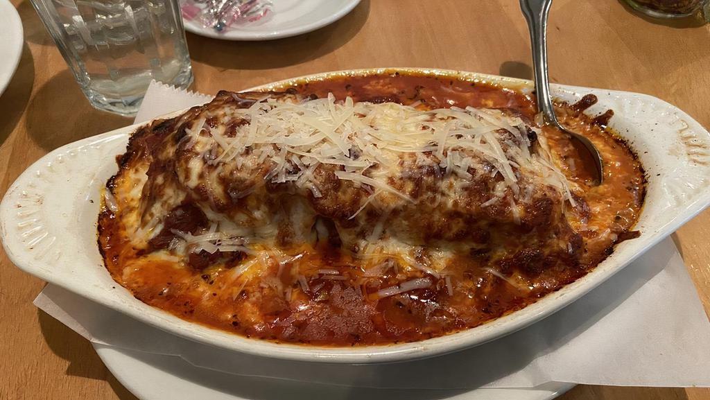 Lasagna · Lasagna, made from scratch, topped with our meat sauce and mozzarella. Add meatballs or Italian sausage for an additional charge.