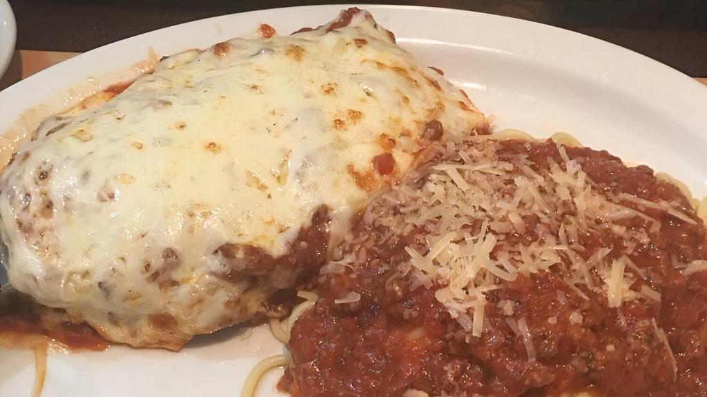 Veal Parmesan · Veal that is breaded with Parmesan cheese and then baked with mozzarella and our meat sauce. Served with spaghetti and meat sauce.
