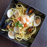 Feast Of The Sea · A combination of sauteed shrimp, mussels and clams served with pasta, garlic bread, and choi...