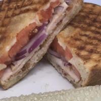 Turkey Bacon Ranch Panini · Roasted turkey, bacon, tomato, roasted red pepper, ranch dressing, American cheese on braide...