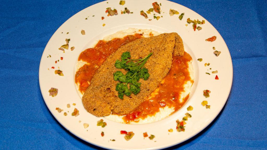 Fish & Grits · Crispy fish over creamy gouda grits in an etouffee sauce. Choice of tilapia or catfish.