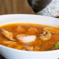 Tom Yum Goong · Shrimp, tomato and mushroom in a mild spicy soup.