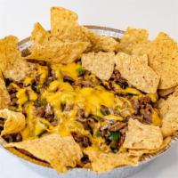 Philly Nachos · Steak, green peppers, onions, salsa, sour cream and whiz.