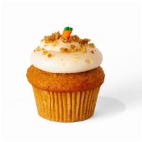Gf Carrot Cake · GF Carrot cupcake, cream cheese frosting, topped with crushed walnuts and a royal icing carr...
