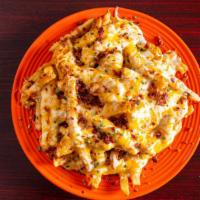 Wack Fries · Thick cut fries topped with wack sauce, cheddar jack cheese, crispy chopped bacon, and chives.