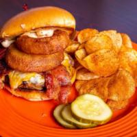Wacko Burger · Topped with melted cheddar jack cheese,  bacon,crispy onion straws  and wack sauce on a brio...