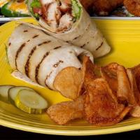 Grilled Chicken Wrap · tender trilled chicken topped with crisp field greens, red onion, tomato, avocado and a bals...
