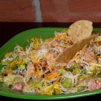 Taco Salad · chopped chicken or beef over crisp romaine tossed with black olives, jalapeno peppers, red o...