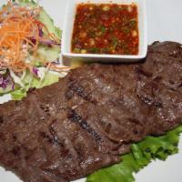 B 31. Bbq Neua Yang · Marinated beef with spices & herbs, grilled, and served with Thai  lime chili sauce. Served ...