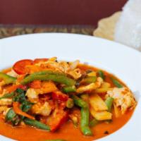 C 36. Gang Ped (Red Curry) · Thai red curry paste cooked with coconut milk, green beans, bamboo shoots, and bell peppers....