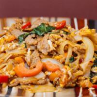 N 39. Pad Kee Mao (Drunken Noodles) · Medium spicy.Stir fried flat rice noodle with eggs, bell peppers, onions, carrots, and fresh...