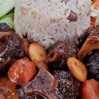 Oxtail · Choose of Two Sides
*Rice & Peas
*White Rice
*Steamed Cabbage 
*Mac & Cheese
* Plantain