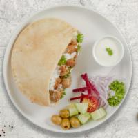 Cluckin' Souvlaki Pita · Grilled chicken with green peppers and onions and tzatziki sauce in a grilled Greek pita.