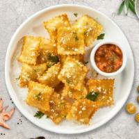 Crispy Ravioli · (Vegetarian) Cheese-filled ravioli breaded and fried until golden brown. Served with housema...