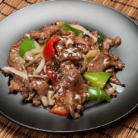 Beef Black Peppers Stir-Fried · Stir-fried slides of beef with black peppers sauce, bell peppers . 
served with rice