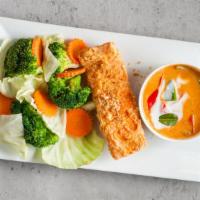 Chu Chee Salmon Or Duck · Mild spicy. Choice of pan-seared salmon or crispy duck topped with red curry sauce. Served w...