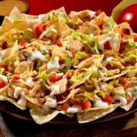 Southwest Chicken Nachos · Crispy chicken, jalapenos, cheddar cheese, onion, Applewood bacon and guacamole served with ...