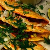 Los Tacos De Birria · 4 flour tacos with Cheese, Birria, onions, cilantro and a side of sauce.