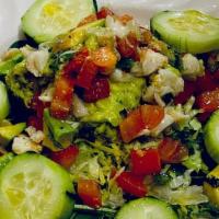 Avocado & Crab Salad · Served with Cucumbers, Tomatoes, Dressed with Fresh Squeezed Lime Juice, & Olive Oil