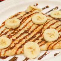Ana Banana · Crepe filled with peanut butter & bananas, topped with chocolate syrup