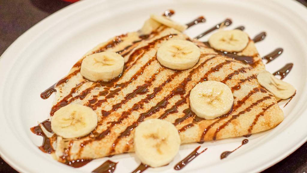 Ana Banana · Crepe filled with peanut butter & bananas, topped with chocolate syrup