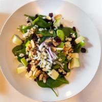 La Familia Salad · Gluten Conscious. Baby spinach with dried cranberries, sliced almonds, green apples, red oni...