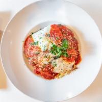 Chicken Parmesan · Chicken breast lightly breaded, pan fried and baked with homemade marinara sauce, topped wit...