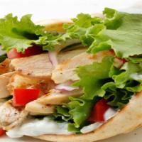 Lamb Or Chicken · Comes with lettuce, tomatoes, onion and tzatziki sauce on pita bread.